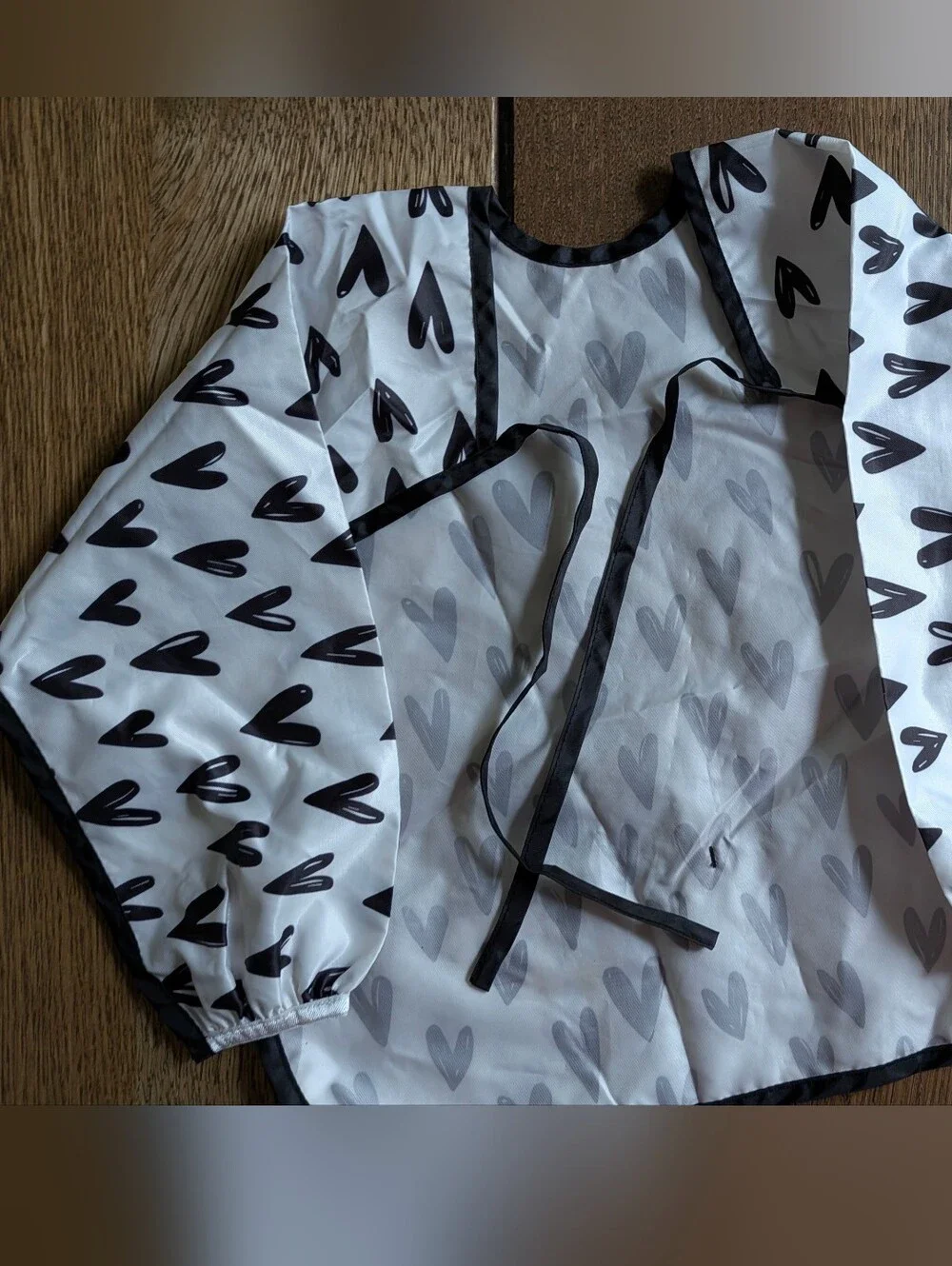 Bumkins White Bib Smock with Black Heart Print